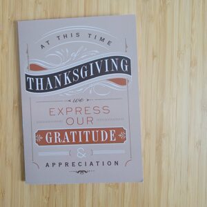 Beige holiday card stating At this time of Thanksgiving, let us express our gratitude & appreciation